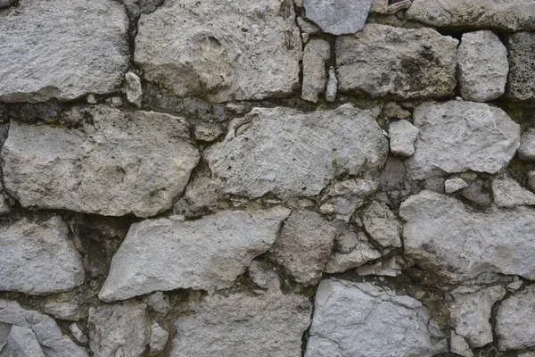 Dışarıdaki taş duvar. Yakın plan. Kirli renk.