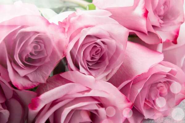 Flower arrangement - a bouquet of pink roses on table close up