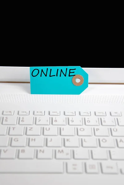 Online written on paper tag — Stock Photo, Image