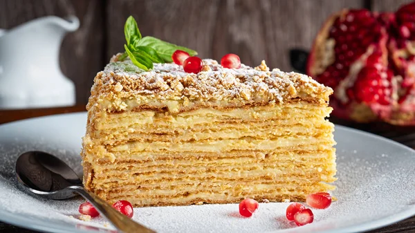 A piece of Napoleon cake. Layered cake with custard