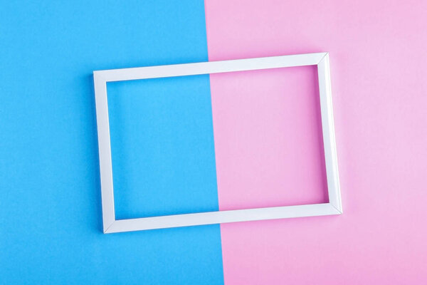 Empty white frame on a duotone background (blue, pink) with copy space for text or lettering. Minimal geometric lines composition. Top view, flat lay, mock up.