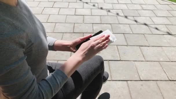 Woman Wiping Disinfecting Smartphone Antibacterial Wipe Swab Moist Towelette Outdoors — Stock Video