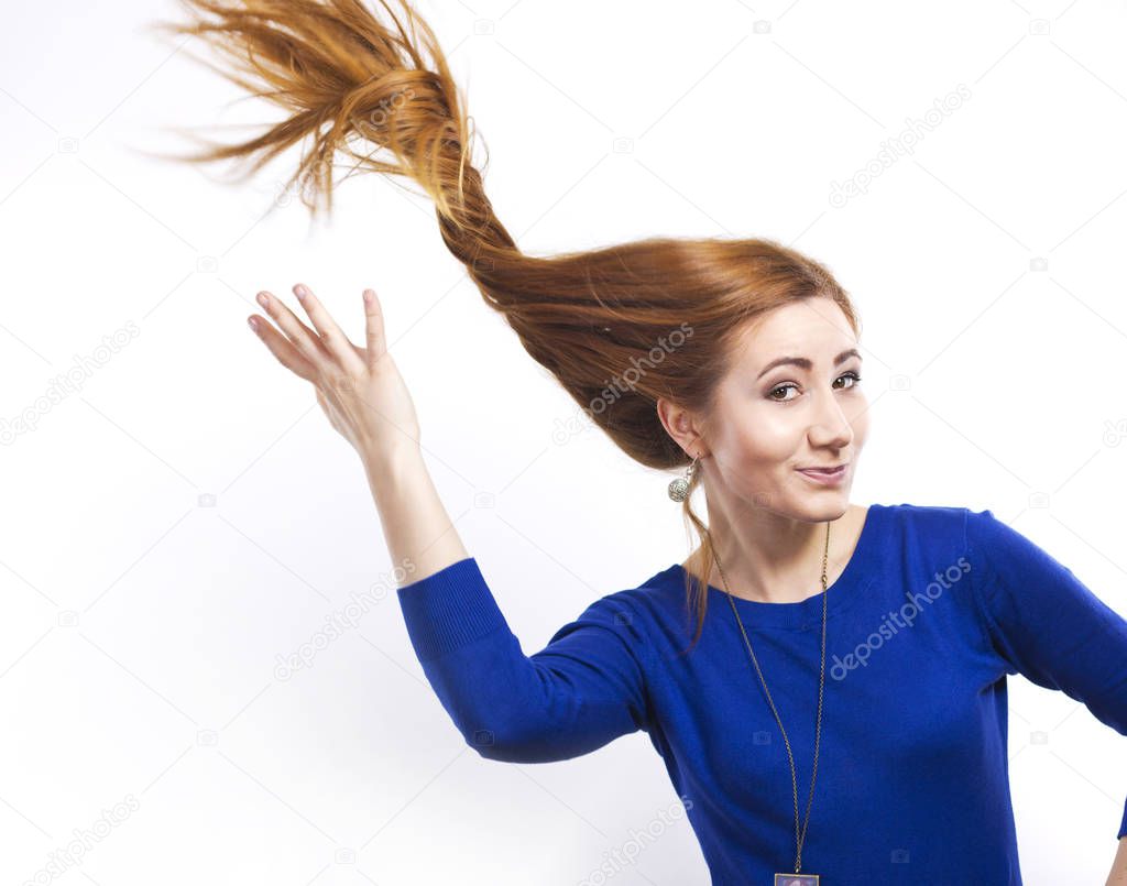 Girl with flying hair.Young smiling girl with long healthy hair. Healthy strong hair. Strong hair. Beautiful slim girl with a haircut. Hair style