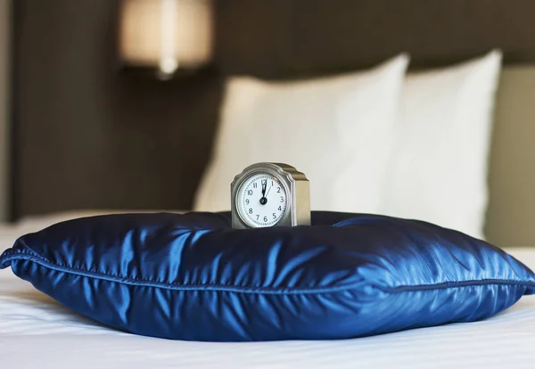 Hotel room.Alarm clock.Twelve o\'clock