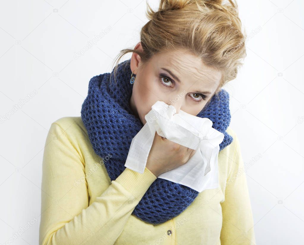  Young blond sick Rhinitis. Stuffy nose. Runny nose.blonde with a handkerchief.