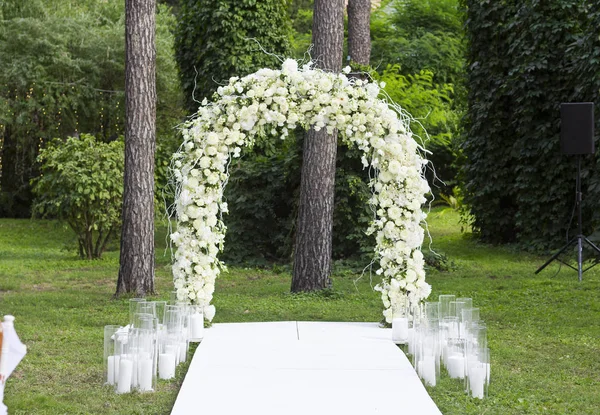 Wedding arch of flowers.Wedding ceremony. Arch. Bride. Floristics.