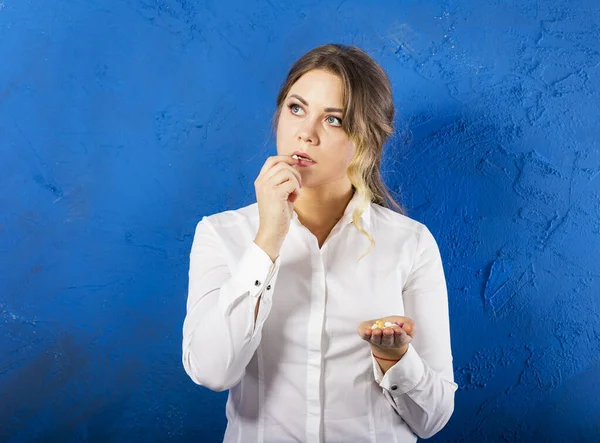 Young Woman Blue Background Take Pills Portrait Serious Woman Drugs — Stock Photo, Image
