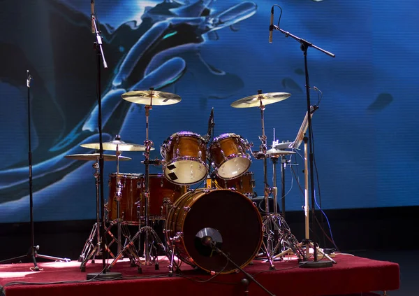 Drum set on a blue background. Drums on stage.