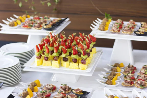 buffet with fruits, cheese and berries