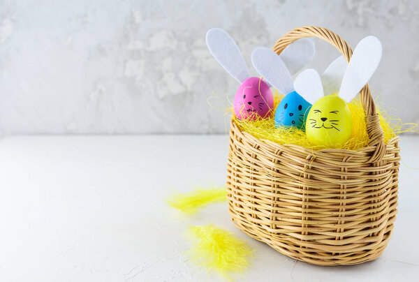 Easter bunnies made from eggs in a basket. Horizontal orientation, copy space.