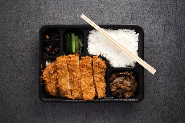 Japanese food tonkatsu rice and vegetable take away on table background — Stock Photo, Image