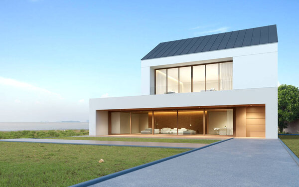 Perspective of modern luxury building with wood terrace and grass field on sea view background, double floor of housing with metal roof design. 3D рендеринг
.