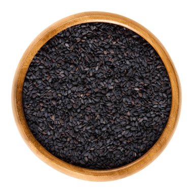 Ayrıca benniseed, ahşap kase, siyah susam