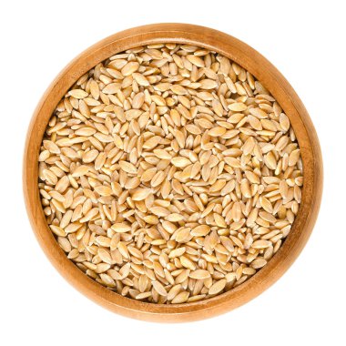 Einkorn buğday üzerinde beyaz ahşap kase