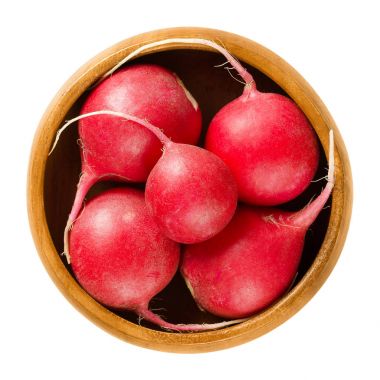 Red radishes in wooden bowl over white clipart