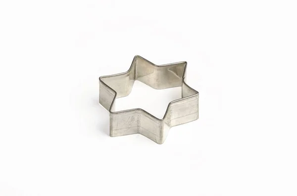 Star shaped Christmas cookie cutter over white — Stock Photo, Image
