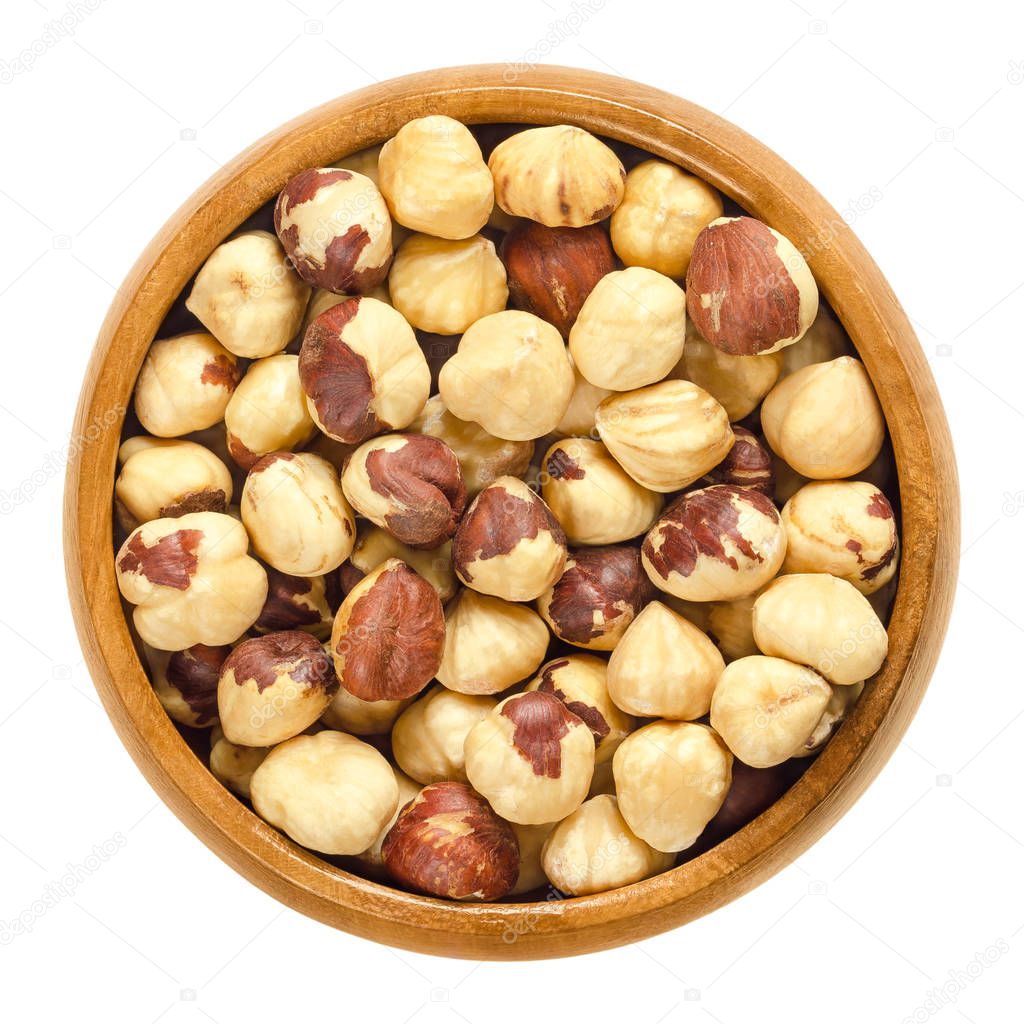 Roasted hazelnuts in wooden bowl