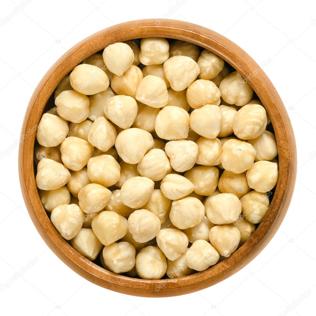 Blanched hazelnuts in wooden bowl