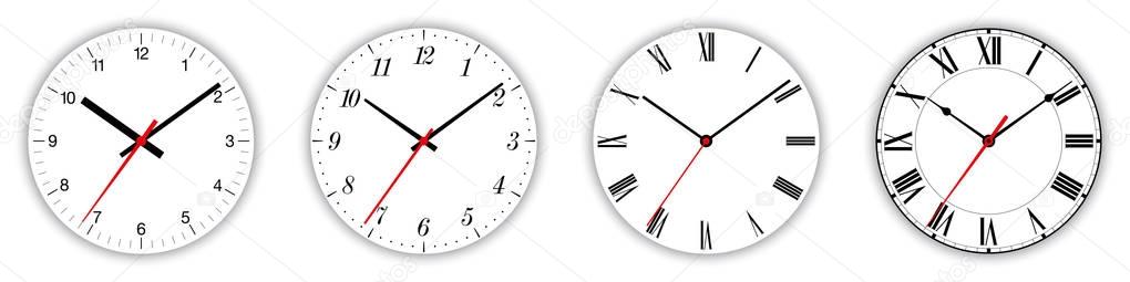 Four different clock faces over white