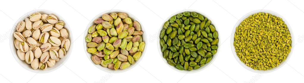 Pistachios in white porcelain bowls over white