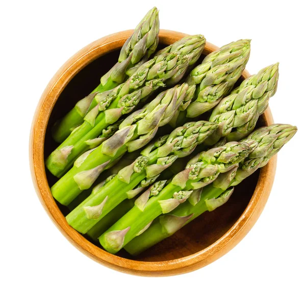 Consigli di asparagi verdi freschi in ciotola di legno — Foto Stock