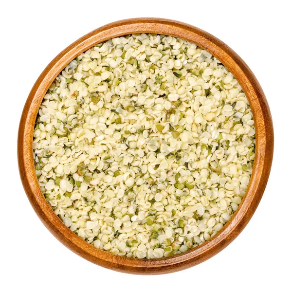 Hulled hemp seeds in wooden bowl over white — Stock Photo, Image