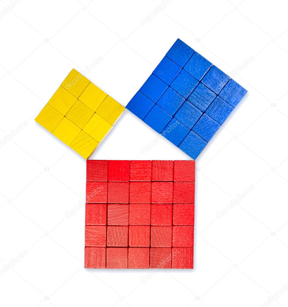 Pythagorean theorem shown with colorful wooden cubes, from above. Pythagoras theorem. Relation of sides of a right triangle. The two smaller squares together have the same area than the big one. Photo