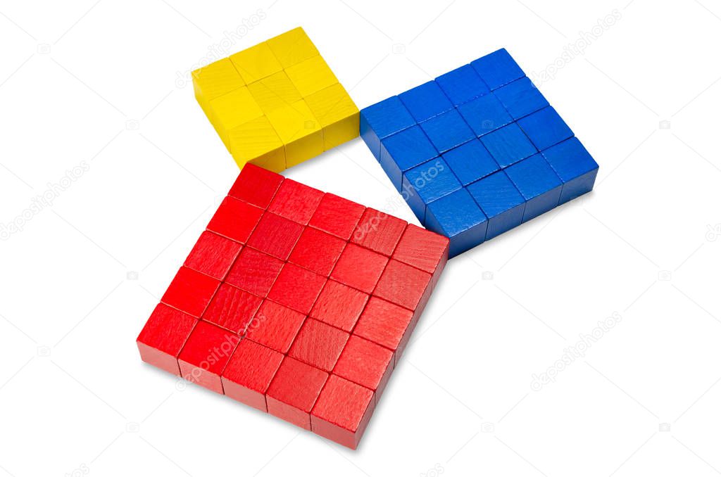 Pythagorean theorem shown with colorful wooden cubes, side view. Pythagoras theorem. Relation of sides of a right triangle. The two smaller squares together have the same area than the big one. Photo.