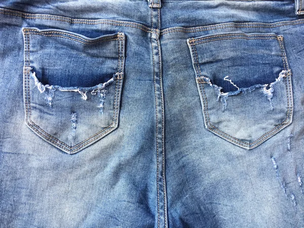 Denim jeans doku veya eski yırtık kot kot arka plan. — Stok fotoğraf