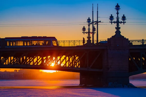 Saint Petersburg. Russia. Trinity bridge. Bridge in St. Petersburg at sunset. Bus. Bridges of Petersburg. Crossing the Neva. Trinity bridge in winter. Travel to Russia. Russia europe.