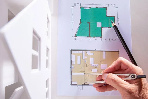 Creating drawings of the future home. Architect at work. Development of the concept of the cottage. Preparation of the layout of the cottage on the basis of the construction plan.