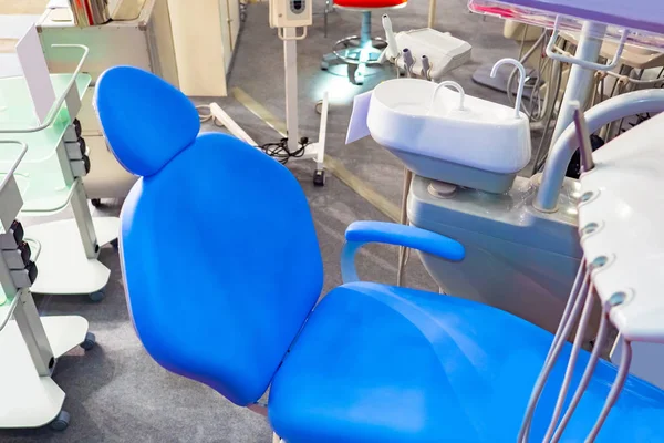 Dentist\'s office. Chair in the dental doctor office top view. Chair for a dentist patient. Equipment for the dental doctor office. Concept - work by a dentist. Medical equipment. Dental treatment.