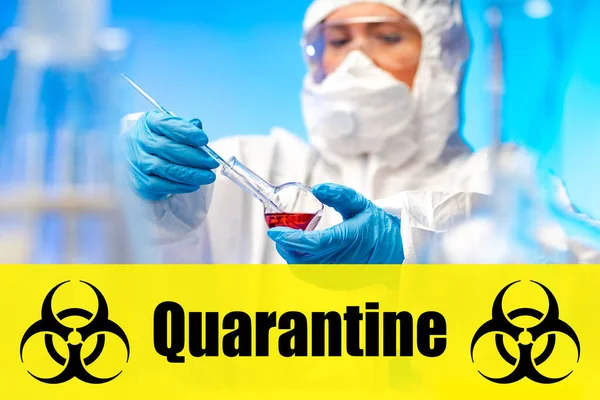 The inscription quarantine and international biohazard sign. Biological laboratory. Scientist with a flask. Caution when handling biological products. Virology. Bacteriology.