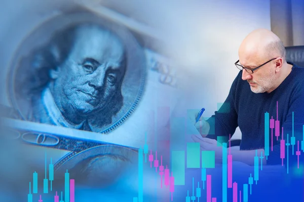 Dollars and currency trader against the background of exchange information. The course of currency trading. Change in the exchange rate of the us currency. Fluctuations in the USD exchange rate.
