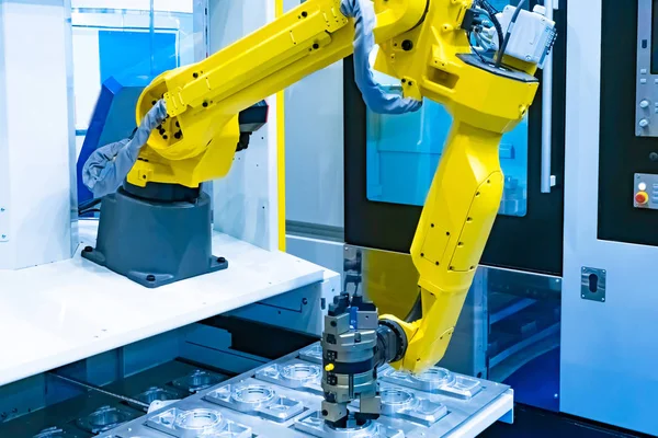 Automated production of aluminum products. Aluminum and industrial robot. The robot makes aluminum parts without human intervention. Robotics. Production automation.
