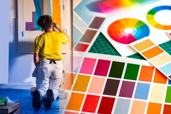 Woman works as a house painter. Color palette next to the painter. Girl draws on the walls of the house. Interior designer. Concept - the choice of the color of the walls in the rooms.