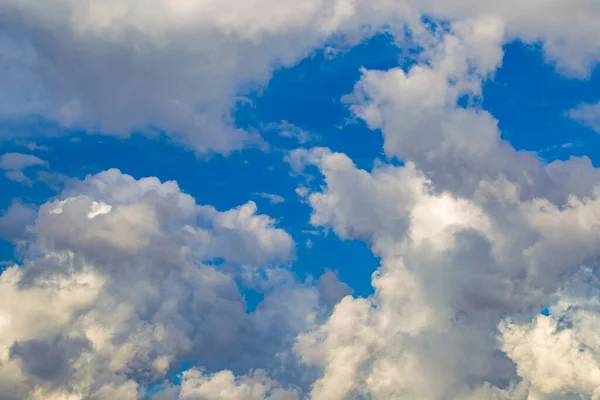 Clouds view from below. Sky is in the clouds. Background - cloudy sky. Nature. Sky on a sunny day. Skyline. Roof of the mouth. Panorama of heaven. Natural background
