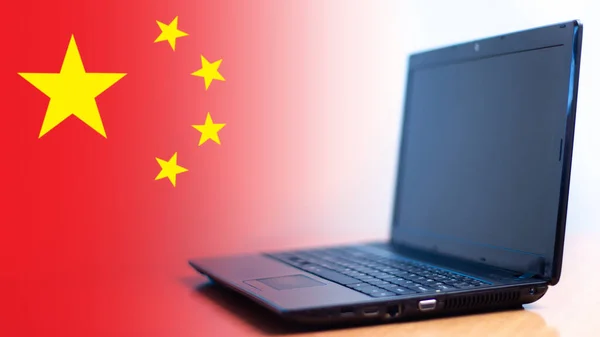 Chinese companies. Computer hardware manufacturing in China. Chinese flag next to a laptop. Electronics Manufacturing in the People\'s Republic of China. Companies producing computers.