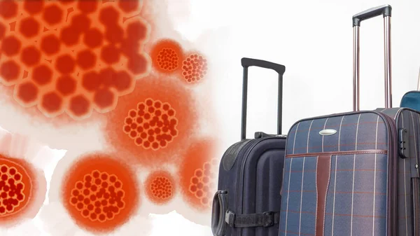 Suitcases next to virus molecules. The spread of the virus among tourists. An epidemic among people returning from travel. Travel suitcases on a white background. Infection. Disease.