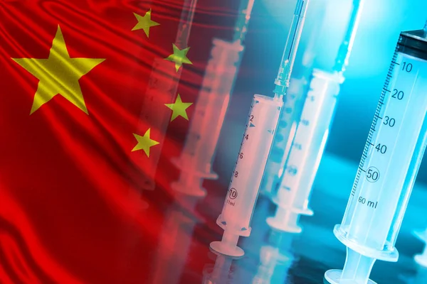 Syringes on the background of the Chinese flag. Drug development in China. Export of Chinese medicines. Deliveries of medicines to the Republic of China. Pharmaceuticals of China. Chinese medicine.