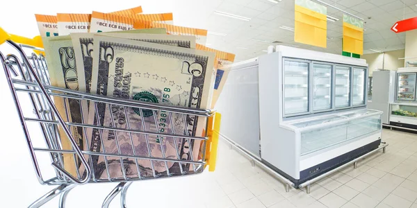 Miniature trolley with money as a symbol of customer demand. Inability satisfy customer demand. Empty supermarket display cases as a symbol of scarcity. Concept - panic due to empty shelves in stores