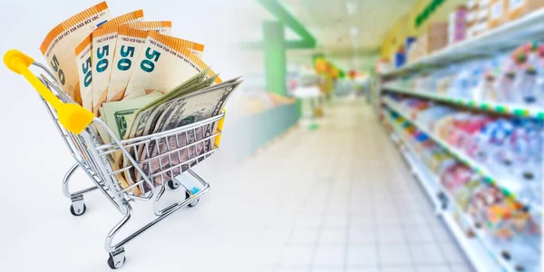 Shopping at the store. Cart with money on the background of an empty supermarket. Concept - panic purchase in a store. Purchase of products for a long time. Buying on the case of food shortage