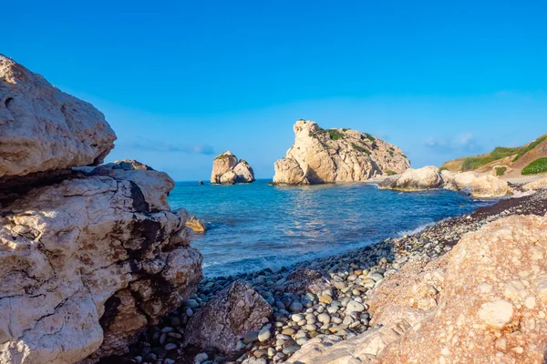 Cyprus. Rock Aphrodite. Cliffs on the beach of Cyprus. Aphrodite\'s stone on the background of blue sky. Tour the Mediterranean Sea. Rocks on the ocean. Scenery. Attractions in the vicinity of Paphos