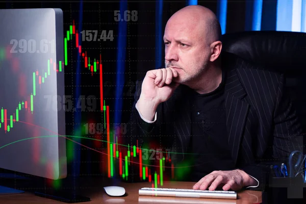 Stock exchange information and a focused person in front of a computer. Remote participation in exchange trading. Currency trader. Risky transactions on the exchange. Monitoring the bidding process.