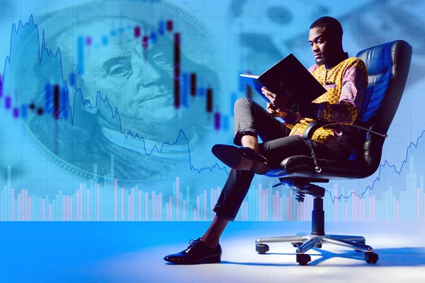 Financier. Guy - background of financial charts. African American in a leather chair. Concept student studying financial analysis. Human is studying at a financial broker. Concept - young investor.