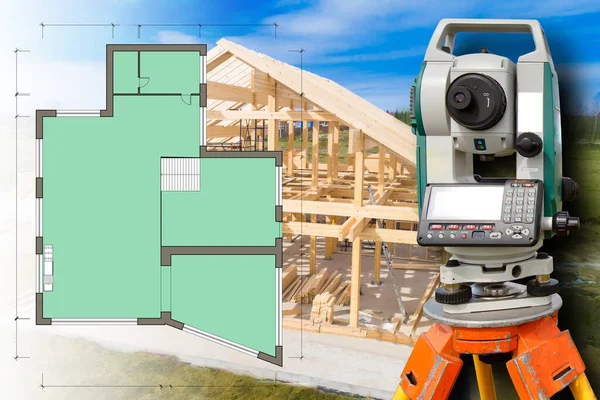 Surveyors Building. Concept - company provides a full range of construction services. Total station next to room plan of house. Frame of a wooden house is set on a foundation. Floor plan of rooms in house