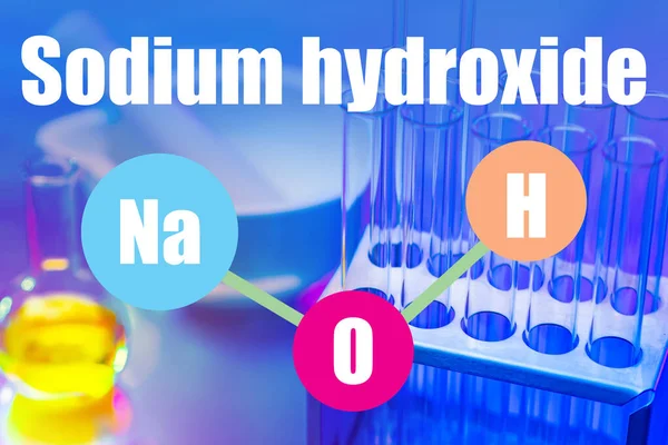 NaOH. Inscription sodium hydroxide. Chemical formula of NaOH. Concept is laboratory tests of sodium. Test tubes on the chemist desk. Chemical experiments with sodium hydroxide. Soap production.
