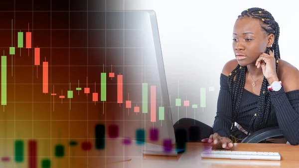 African American woman works with a computer. Concept - girl trades on an electronic exchange. Trading on the financial exchange via the Internet. Buying stocks online. Woman keeps track of prices.