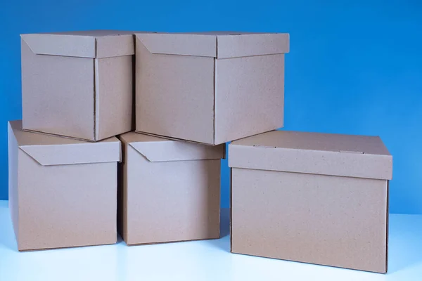 Eco-friendly product packaging. Cardboard boxes. Caring for nature. Ecological compatibility. Biodegradable containers. Environmental protection.