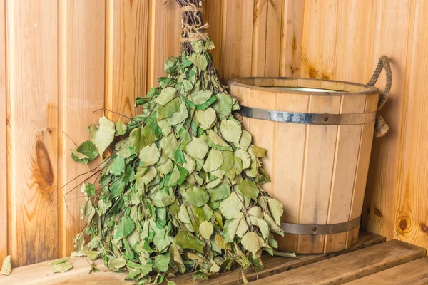 Birch broom with wooden bucket in the bath. — Stock Image Birch Broom Wooden Bucket Bath Stock Image